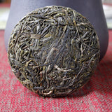 100g Yunnan Pu'er tea Icelandic raw peacock green cake seven cakes Mengku tea