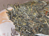 100g Yunnan Yiwu District Yiwu Sun Green Pu'er Raw Tea Cake Seven Seed Cake Tea
