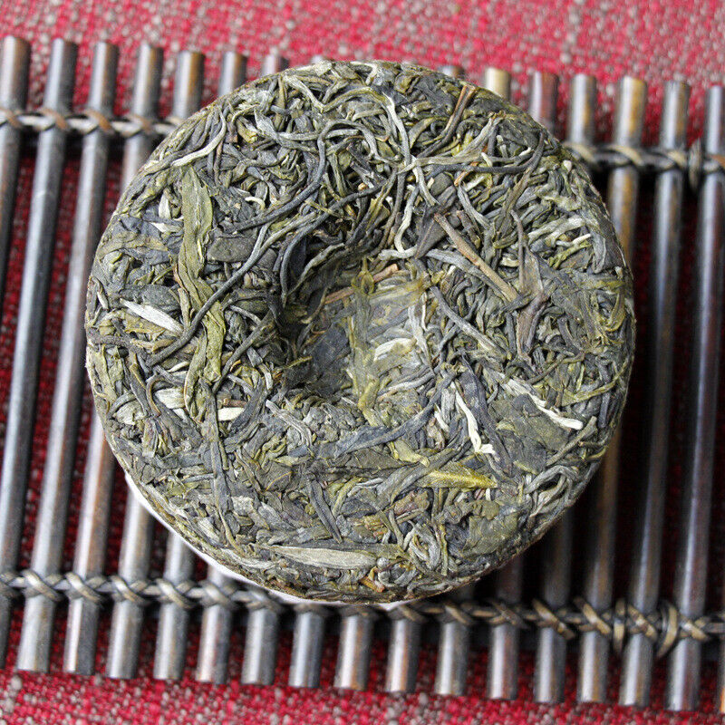 100g Yunnan Pu'er tea Icelandic raw peacock green cake seven cakes Mengku tea