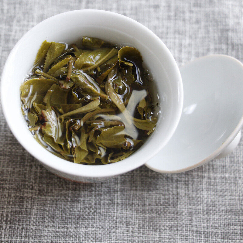 100g Yunnan Pu'er tea Icelandic raw peacock green cake seven cakes Mengku tea