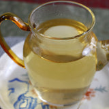 100g Yunnan Pu'er tea Icelandic raw peacock green cake seven cakes Mengku tea