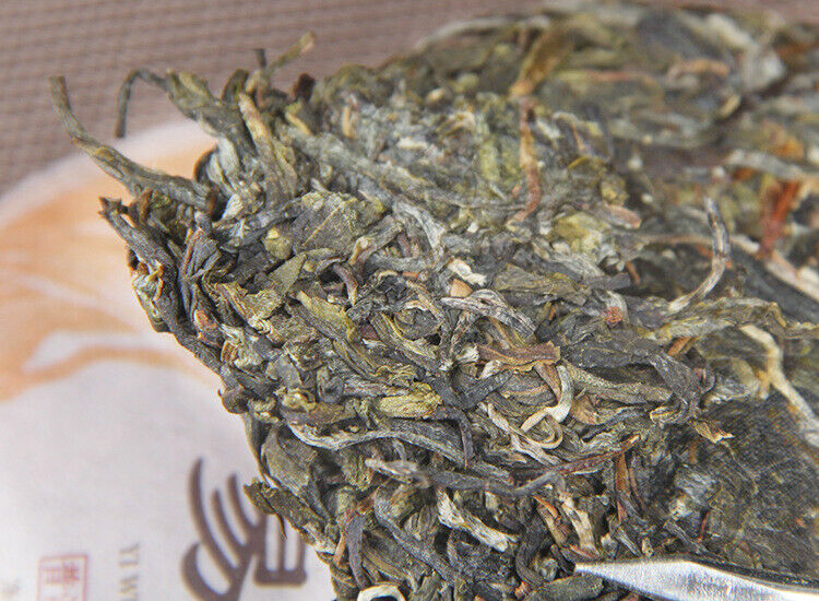 100g Yunnan Yiwu District Yiwu Sun Green Pu'er Raw Tea Cake Seven Seed Cake Tea
