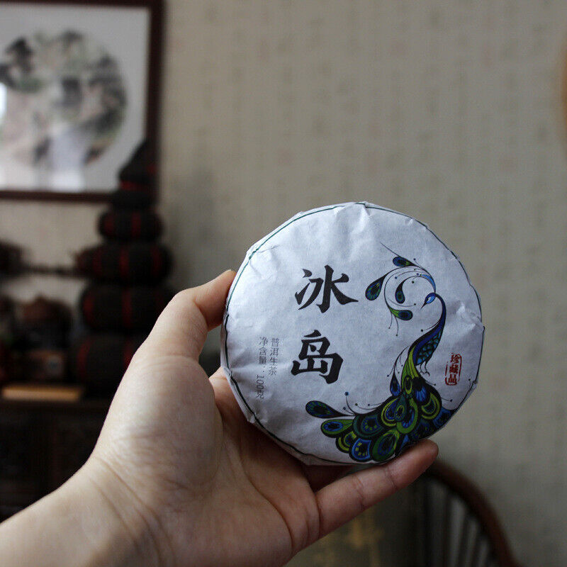 100g Yunnan Pu'er tea Icelandic raw peacock green cake seven cakes Mengku tea