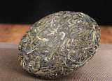 100g Yunnan Yiwu District Yiwu Sun Green Pu'er Raw Tea Cake Seven Seed Cake Tea