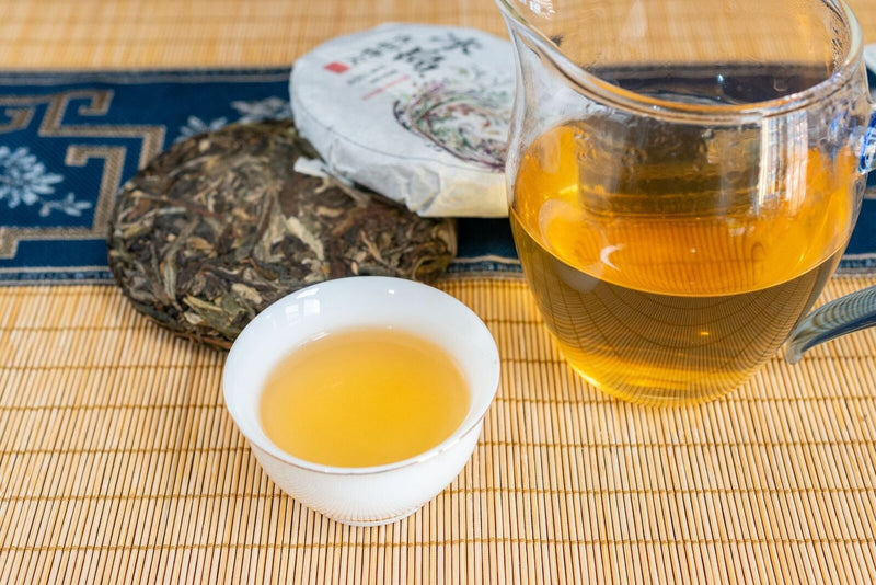 100g Pu'er Raw Tea Iceland Yunnan Ancient Tea Spring Tea Cake Orchid Fragrance