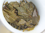100g Yunnan Menghai He Kai Sun Green Pu-erh Raw Tea Cake Seven Seed Cake Tea