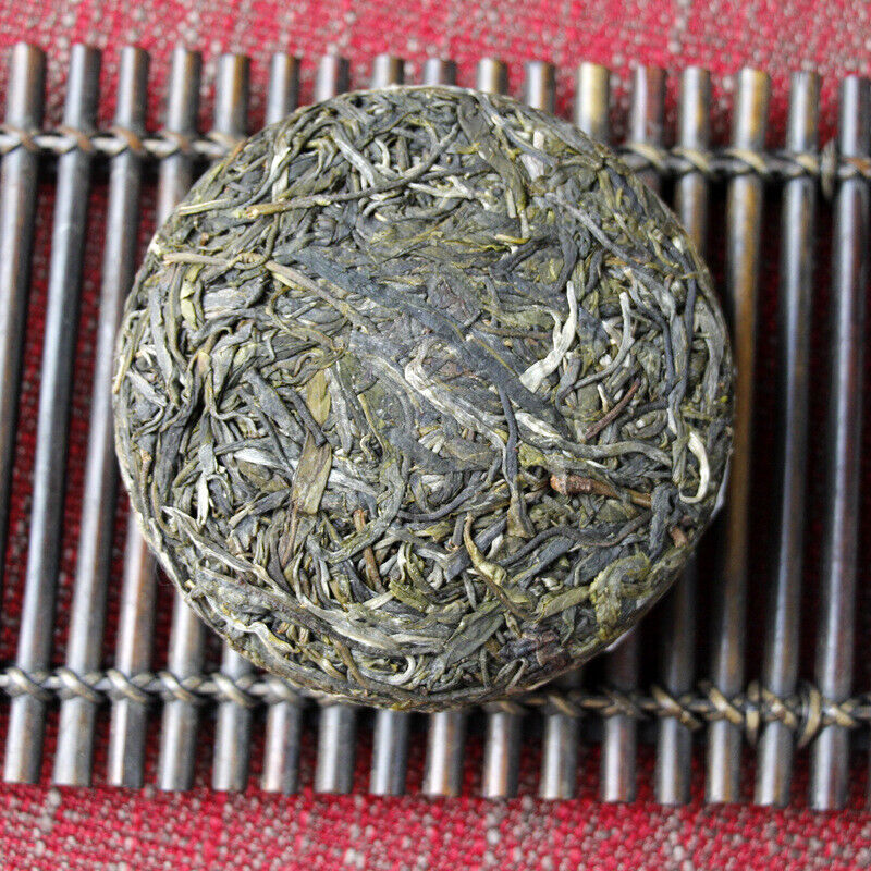100g Yunnan Pu'er tea Icelandic raw peacock green cake seven cakes Mengku tea