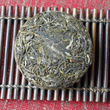 100g Yunnan Pu'er tea Icelandic raw peacock green cake seven cakes Mengku tea