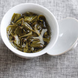 100g Yunnan Pu'er tea Icelandic raw peacock green cake seven cakes Mengku tea