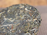 100g Yunnan Menghai Sleeping Deer Mountain Sun Green Pu'er Raw Tea Cake