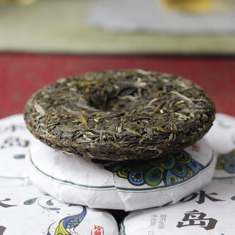 100g Yunnan Pu'er tea Icelandic raw peacock green cake seven cakes Mengku tea