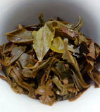 357g Pu'er raw tea golden leaves golden Mengku yellow slices, seven seed cakes