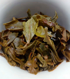 357g Pu'er raw tea golden leaves golden Mengku yellow slices, seven seed cakes