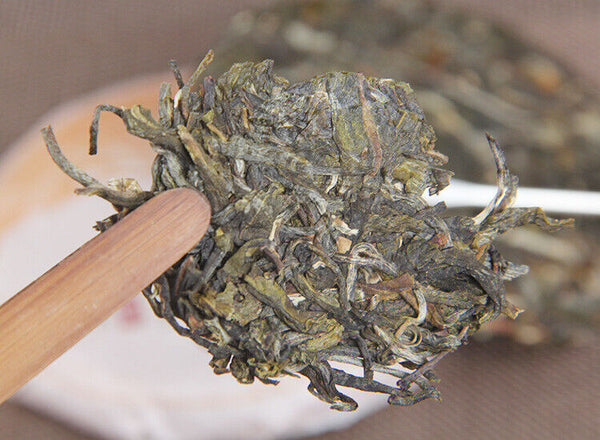 100g Yunnan Yiwu District Yiwu Sun Green Pu'er Raw Tea Cake Seven Seed Cake Tea