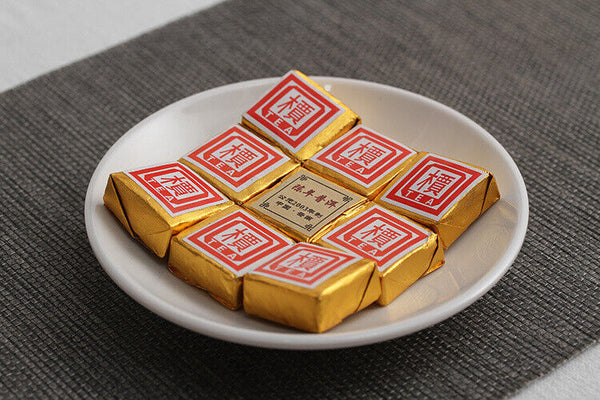 Menghai Pu'er ripe tea small square brick tea leaves sinensis word Pu'er tuocha