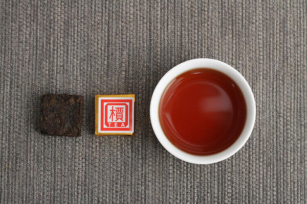 Menghai Pu'er ripe tea small square brick tea leaves sinensis word Pu'er tuocha