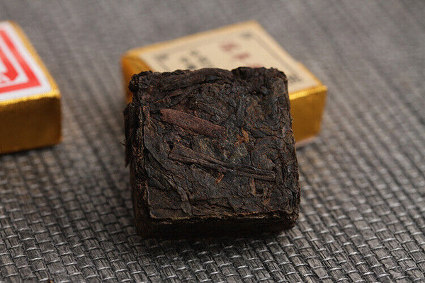 Menghai Pu'er ripe tea small square brick tea leaves sinensis word Pu'er tuocha