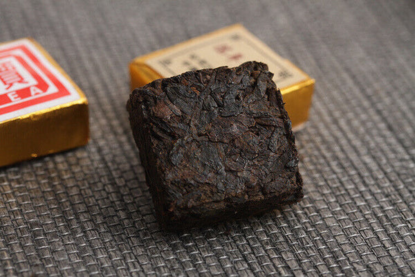 Menghai Pu'er ripe tea small square brick tea leaves sinensis word Pu'er tuocha