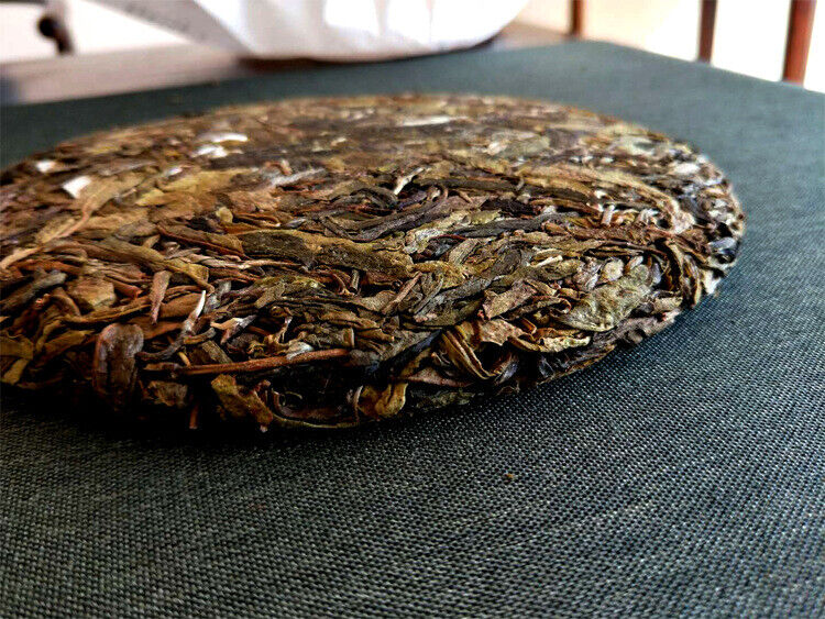 357g Pu'er raw tea golden leaves golden Mengku yellow slices, seven seed cakes