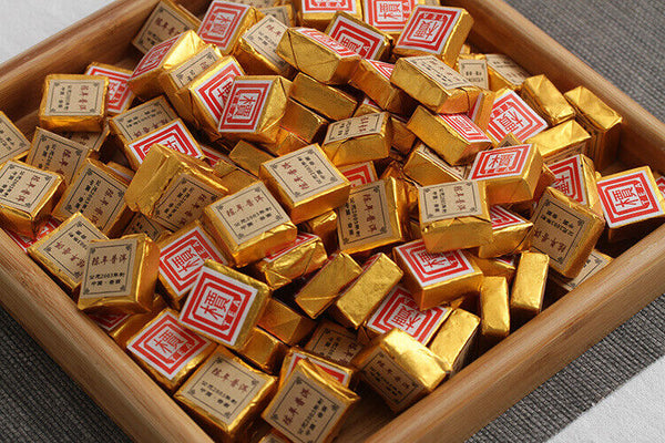 Menghai Pu'er ripe tea small square brick tea leaves sinensis word Pu'er tuocha