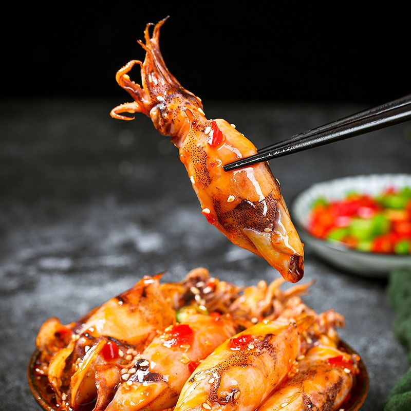 Spicy ready-to-eat seafood snack: baby octopus and octopus in glass