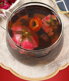 Dark plum hawthorn lotus leaf tea flowers and plants cold brewed tangerine tea