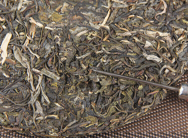 Icelandic raw tea cake spring tea pure sweet Mengku Pu'er seven seed cake tea