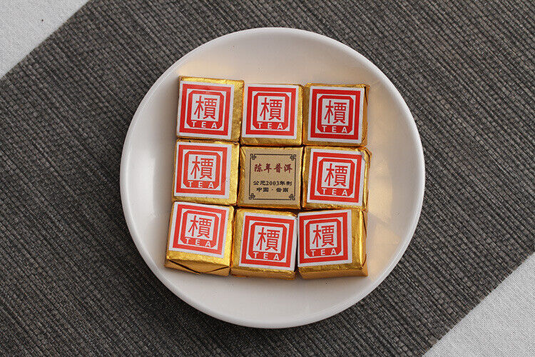Menghai Pu'er ripe tea small square brick tea leaves sinensis word Pu'er tuocha