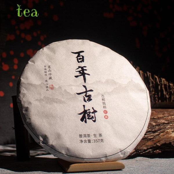CIFbuy Yunnan Centennial Ancient Tree Golden Leaf Raw Puer Qizi Tea Cake 357g
云南百年古树金叶生普洱七子饼茶357克