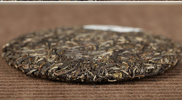 Xiaguan Qian Jia Zhai Wild Aged Old Tree Round Cake Puer Raw Pu'er Tea 357g