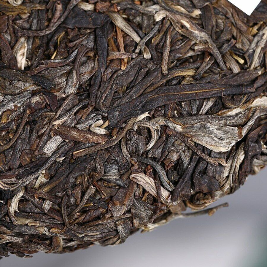 Lao Tong Zhi 9948 Raw Pu-erh Tea Haiwan Old Comrade Shen Puer Tea 357g