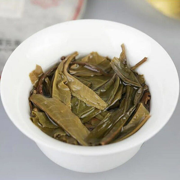 Haiwan YiWu Qi Zi Yuan Sheng Puer Tea YunNan Famous Aged Tree Raw Puer 357g
