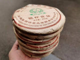 2006 Nanqiao Menghai Arbor Wild Tea Silver Needle Tribute Cake Raw Pu'er 250g